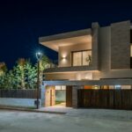 A Your Host Marrakech concierge thoughtfully curating a collection of unique experiences for a client.