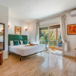 Marrakech concierge: key opening a decorated wooden door with lantern – Your Host Marrakech