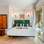 Short‑term rental management Marrakech: owner relaxing while guests enjoy the pool – Your Host Marrakech