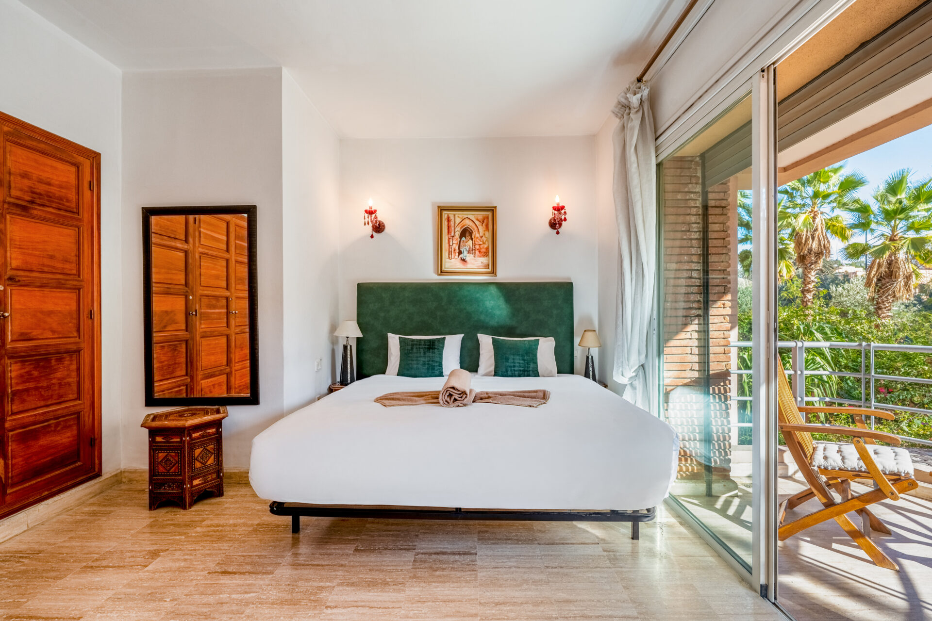Short‑term rental management Marrakech: owner relaxing while guests enjoy the pool – Your Host Marrakech
